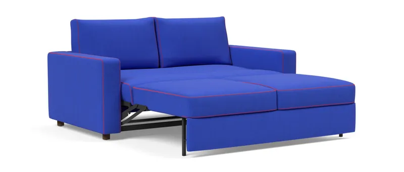 Platzieren Sie die beiden Rückenkissen des NEAH X Schlafsofas und legen Sie entspannt die Beine hoch