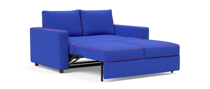 Platzieren Sie die Kissen an der festen Rückenlehne des NEAH X Schlafsofas und legen Sie die Beine hoch